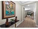 Spacious entryway showcasing hardwood floors and a view of the living room at 3639 Santa Caterina Blvd, Lakewood Ranch, FL 34211