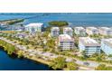 Aerial view showcasing the community's waterfront location and proximity to a marina at 396 Aruba Cir # 103, Bradenton, FL 34209