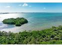 Aerial view of waterfront property with lush landscaping and beautiful water views at 396 Aruba Cir # 103, Bradenton, FL 34209