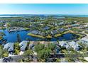 Aerial view of a luxury waterfront community with lake and houses at 11120 Sanctuary Dr, Bradenton, FL 34209
