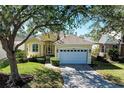 Single-story house with attached garage and well-manicured lawn at 11120 Sanctuary Dr, Bradenton, FL 34209