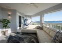 Relaxing living room with sectional sofa, hanging chair, and water views at 1333 Perico Pointe Cir, Bradenton, FL 34209