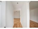 Bright hallway with light wood flooring leading to other rooms at 208 36Th W St, Bradenton, FL 34205