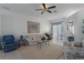 Bright living room featuring comfortable seating, a coffee table, and a large area rug at 4569 35Th Avenue E Cir, Palmetto, FL 34221