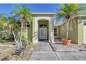 Attractive entryway with arched detail and landscaping at 5365 Matthew Ct, Sarasota, FL 34231