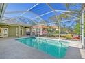 Relaxing screened-in pool area with backyard view at 5365 Matthew Ct, Sarasota, FL 34231