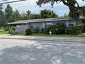 Gray house with pink door and mailbox, street view at 1680 17Th St, Sarasota, FL 34234