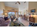 Open living room and kitchen with high ceilings and access to a balcony at 1761 Auburn Lakes Dr # 33, Venice, FL 34292