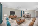 Bright and airy living room with hardwood floors and ample seating at 2316 Harrier Way, Nokomis, FL 34275