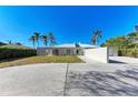Modern waterfront home with expansive windows and private pool at 320 S Shore Dr, Sarasota, FL 34234