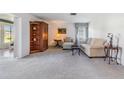 Bright living room with light beige carpeting and comfy seating at 3641 Somerville Dr # 1506, Sarasota, FL 34232