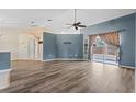Bright living room featuring hardwood floors and access to a back patio at 4905 22Nd E Ct, Bradenton, FL 34203