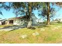 Side view of Ranch Style Home with mature landscaping at 503 59Th Avenue W Dr, Bradenton, FL 34207