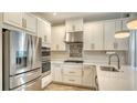 Modern kitchen featuring stainless steel appliances, stylish cabinetry, and quartz countertops at 5548 Summit Gln, Bradenton, FL 34203