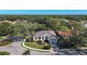 Aerial view of a single-Gathering home with a tile roof and landscaped yard at 6615 Hunter Combe Xing, University Park, FL 34201