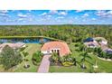Luxury property on a lake with mature trees and other homes nearby at 17113 1St E Dr, Bradenton, FL 34212