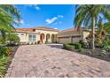 Home with three-car garage and paver driveway at 17113 1St E Dr, Bradenton, FL 34212