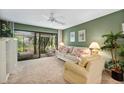 Relaxing living room featuring a comfy sofa and access to a patio at 1720 Glenhouse Dr # 330, Sarasota, FL 34231