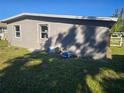 Unfinished side of the house, showing new windows and siding at 21459 Olean Blvd, Port Charlotte, FL 33952