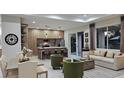 Open floor plan with modern kitchen, living area, and dining space at 5274 Neon Ave, North Port, FL 34291