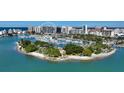 Aerial view of waterfront high-rise building and marina at 1155 N Gulfstream Ave # 207, Sarasota, FL 34236