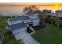 Stunning waterfront home with a large backyard, pool, and beautiful sunset views at 3804 Bayside Dr, Bradenton, FL 34210