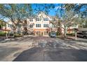 Condo building with parking and lush landscaping at 4140 Central Sarasota Pkwy # 1233, Sarasota, FL 34238