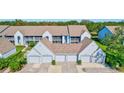 Condos with attached garages, showcasing parking and building design at 6713 Stone River Rd # 205, Bradenton, FL 34203