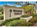 Woodside Terrace community entrance sign at 7171 Wood Creek Dr # 5, Sarasota, FL 34231