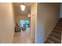 Inviting living room featuring tiled floors, comfortable seating, and access to an outdoor space at 109 Tortuga Dr, Nokomis, FL 34275