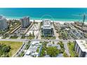 Aerial view showcasing condo location near beach and other buildings at 1102 Benjamin Franklin Dr # 407, Sarasota, FL 34236