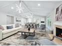 Spacious living room featuring a fireplace and large windows at 1621 Pine Bay Dr, Sarasota, FL 34231