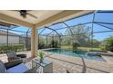Relaxing screened-in pool and spa with patio furniture at 17923 Polo Trl, Bradenton, FL 34211
