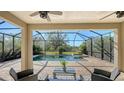 Relaxing screened-in pool and spa area with seating at 17923 Polo Trl, Bradenton, FL 34211