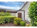 Landscaped yard with a brown storage shed at 2917 Park Lake Dr # 2917, Bradenton, FL 34209
