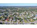 Aerial view showing the house's location in a residential neighborhood near the coast at 3615 Kingston Blvd, Sarasota, FL 34238