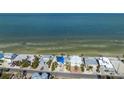 Aerial view of beachfront property, showcasing its location and ocean views at 404 S Bay Blvd, Anna Maria, FL 34216