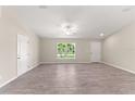 Bright living room featuring tile floors and neutral walls at 6993 Hawksbury St, Englewood, FL 34224