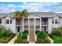 Two-story building with inviting landscaping at 905 Addington Ct # 203, Venice, FL 34293