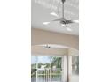 Living room with ceiling fans and sliding glass doors offering water views at 905 Addington Ct # 203, Venice, FL 34293