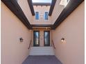 Shared entryway with brick walkway and lighting at 10817 Tarflower Dr # 202, Venice, FL 34293