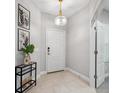 Bright and airy entryway with tile floors and decor at 12657 Coastal Breeze Way, Bradenton, FL 34211