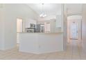 Kitchen features a breakfast bar and modern appliances at 2073 Damascus Ln, Punta Gorda, FL 33983