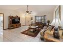 Bright and airy living room featuring comfortable furniture and a tile floor at 210 20Th W St, Bradenton, FL 34205