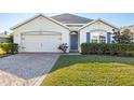 Single-story house with a two-car garage and well-manicured lawn at 28214 Arrowhead Cir, Punta Gorda, FL 33982