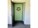 Condo entry with a light green door and a lovely wreath at 3504 Beneva Rd # 206, Sarasota, FL 34239