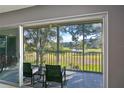 Spacious lanai with sliding doors offering scenic views at 3620 Ironwood Cir # 206O, Bradenton, FL 34209