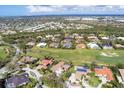 Luxury homes community with golf course, and houses with solar panels at 4211 Palacio Dr, Sarasota, FL 34238