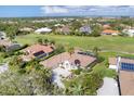 Golf course community with upscale homes and solar energy features at 4211 Palacio Dr, Sarasota, FL 34238