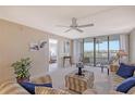 Spacious living room with water views and access to balcony at 5911 Midnight Pass Rd # 504, Sarasota, FL 34242